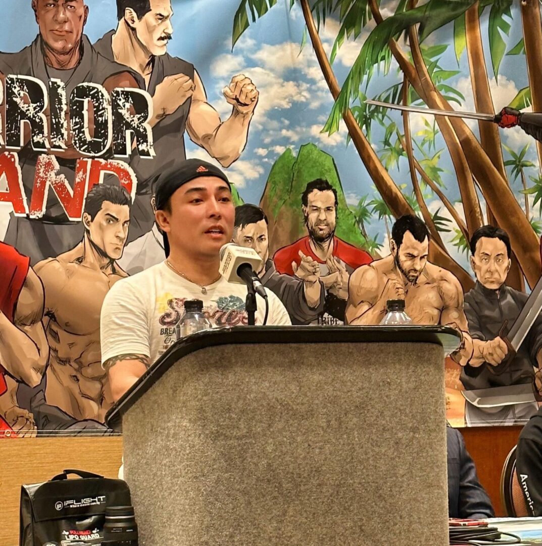 A person wearing a cap giving a speech